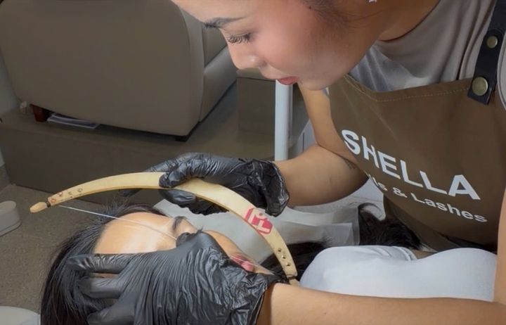 Brow lamination on a model during a class at Shella Nails & Lashes